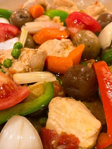 Cooked Chicken Afritada with Bell Peppers, Tomatoes, Onions, Carrots, Potatoes
